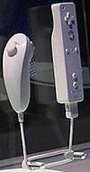 Nunchuck: 2 buttons, one analog stick. Wiimote: 7 front-facing buttons, one rear button, d-pad. Motion control on both controllers. Entire apparatus is of no set dimensions or distance apart.